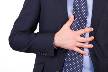 mide ekşimesi muzdarip işadamı.