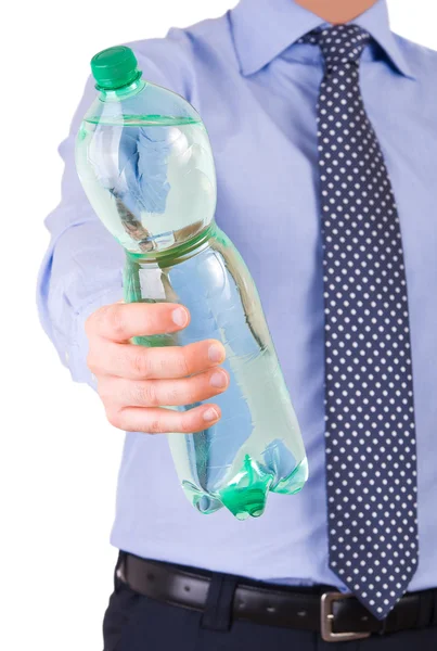 Empresário oferecendo uma garrafa verde . — Fotografia de Stock
