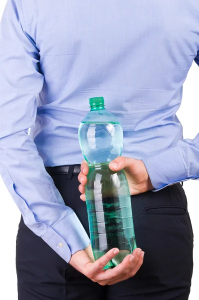 Empresário segurando garrafa verde nas costas . — Fotografia de Stock