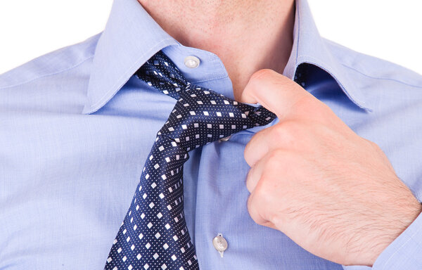 Businessman pulling his collar.