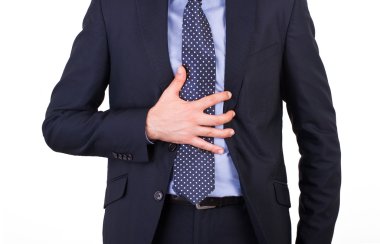 mide ekşimesi muzdarip işadamı.