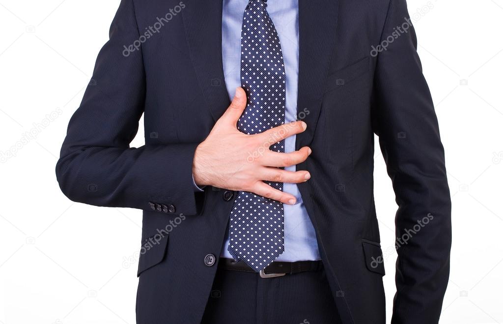 Businessman suffering from heartburn.