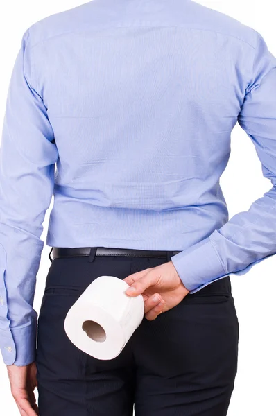 Zakenman houden toiletpapier achter zijn rug. — Stockfoto