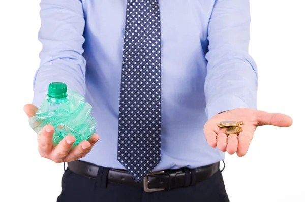 Businessman holding crushed bottle and coins. — Stock Photo, Image