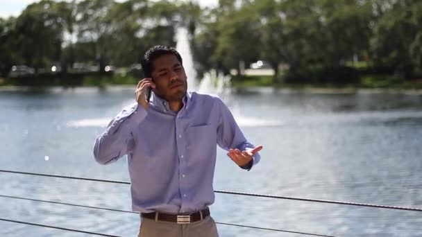 Upset businessman on phone. walking — Stock Video