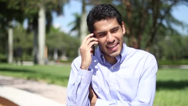 Happy businessman talking at phone. good news. sitting down — Stock Video