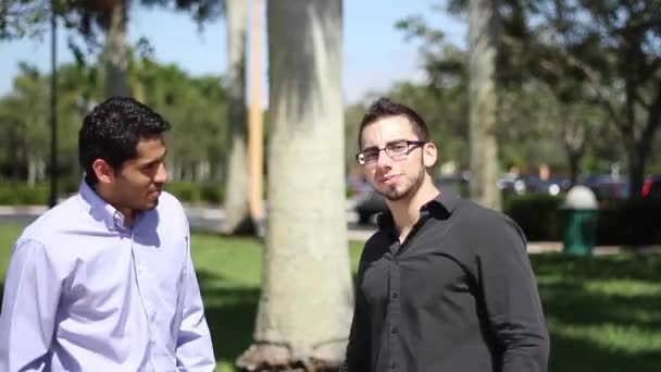 Businessmen with thumbs up looking to the camera — Stock Video