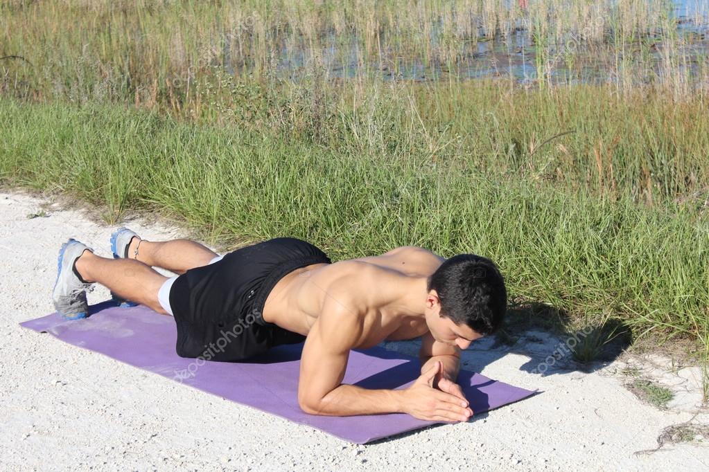 Crossfit training fitness man doing plank