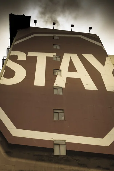 Stay sign painted on building — Stock Photo, Image