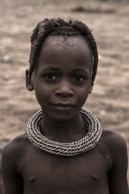 Portrait of a young kid of the Himba tribe, Namibia clipart