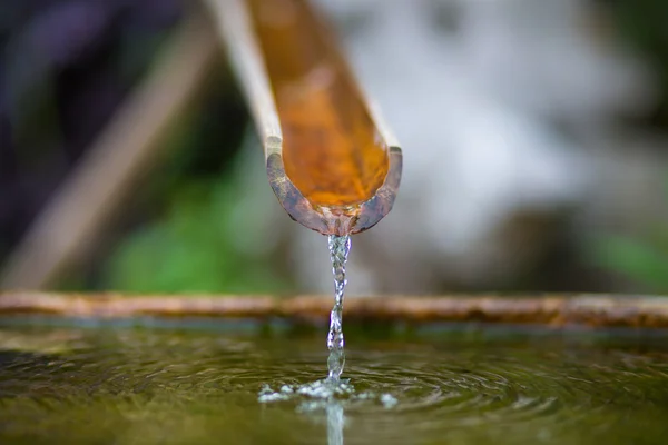 Bamboo fountain with water in a temple — Stock Photo, Image