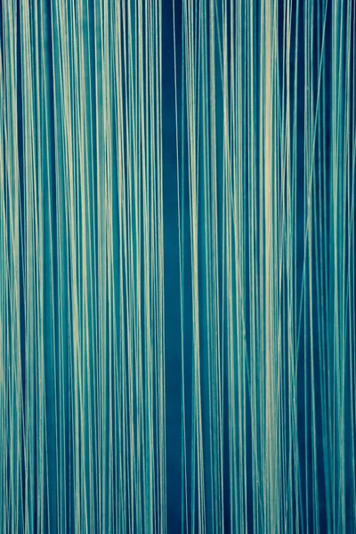 Blauwe abstracte achtergrond gemaakt van verticale lijnen — Stockfoto