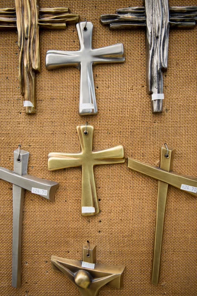 Christian religious crosses hanging on the canvas wal — Stock Photo, Image