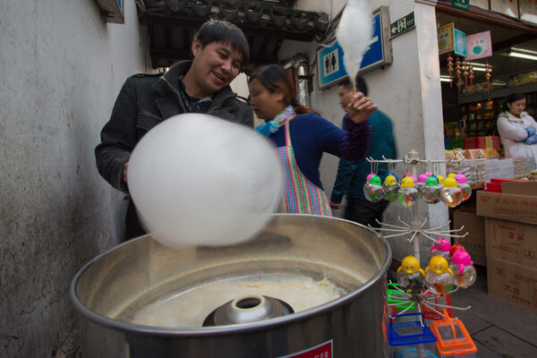 People making sugar-candy floss in Shanghai