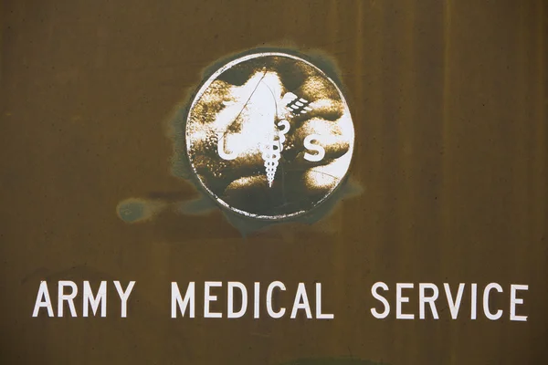 Military background with a symbol of medical service — Stock Photo, Image