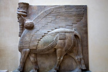 Mesopotamian sculpture at the Louvre Museum in Paris. clipart