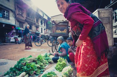Nepalese women working on a fruits and vegetables market in nepa clipart