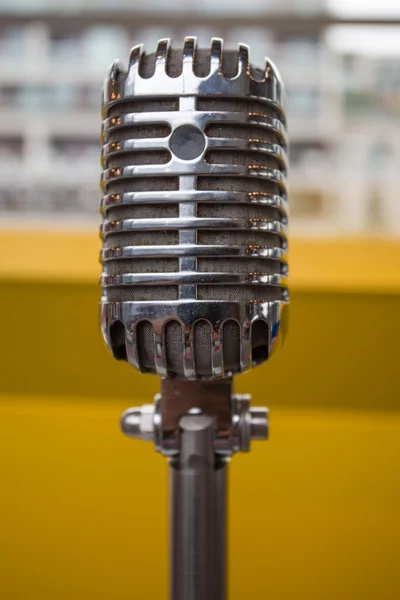 Vintage microphone on a yellow background — Stock Photo, Image