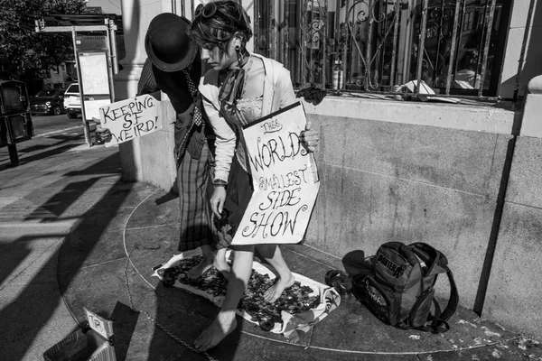 Couple performing in the street with nice message boards — Stock Photo, Image