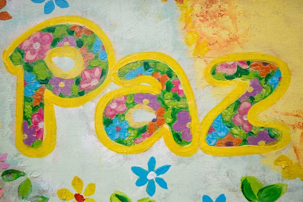 Λέξη paz ή ειρήνη στα ισπανικά ζωγραφισμένα σε έναν ξύλινο πίνακα — Φωτογραφία Αρχείου