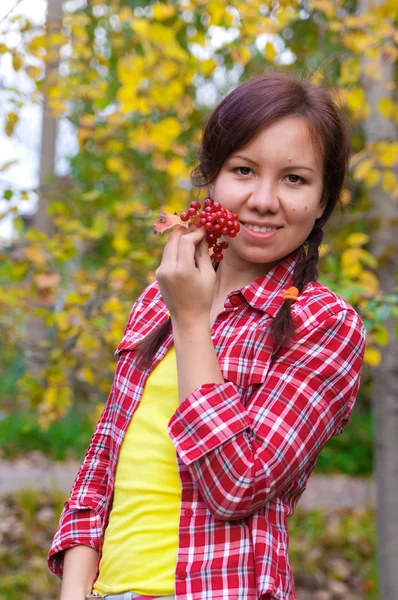 Girl with red berries — Stock Photo, Image