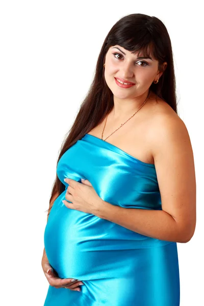 Pregnant woman wearing blue dress Royalty Free Stock Photos