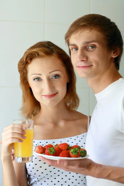 Young couple have breakfast in bed — Stock Photo, Image