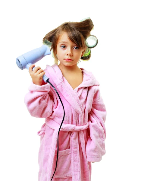 Menina com um pente em encrespadores de cabelo — Fotografia de Stock