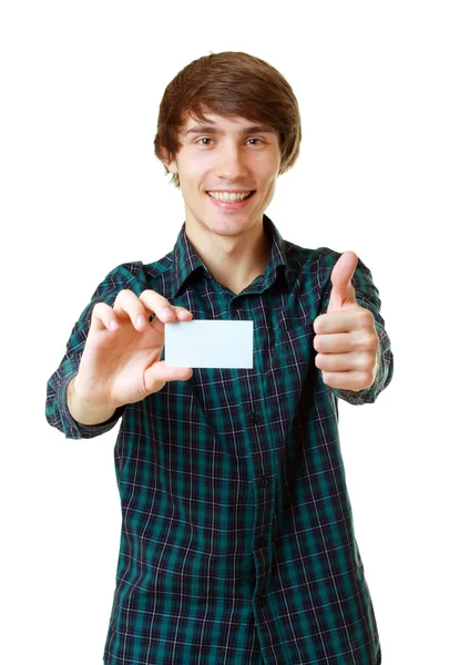 空白の白いカードを保持している若い笑みを浮かべて男 ロイヤリティフリーのストック画像
