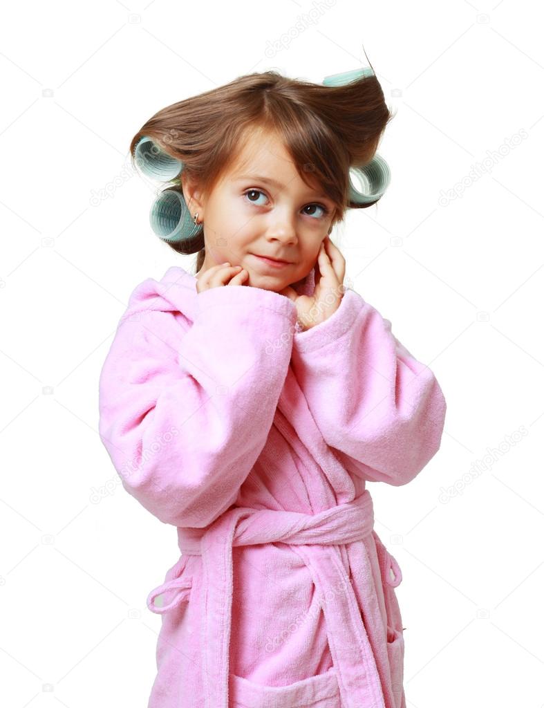 Girl with a comb in hair curlers