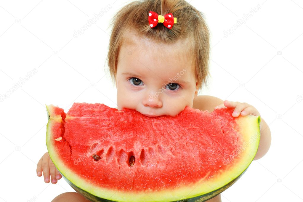 Cute little girl eat watermelon slice