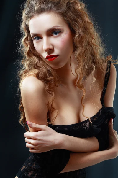 Beautiful young woman in black lingerie — Stock Photo, Image