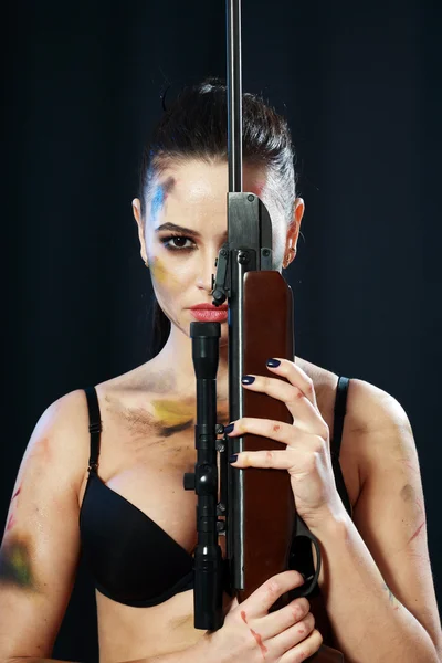 Woman holding weapon — Stock Photo, Image