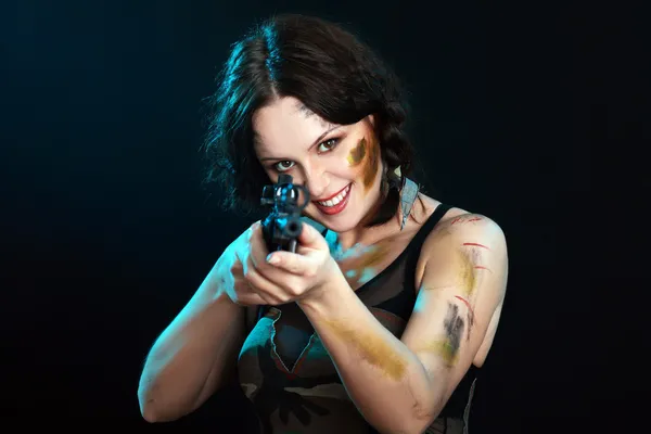 Beautiful woman holding weapon — Stock Photo, Image