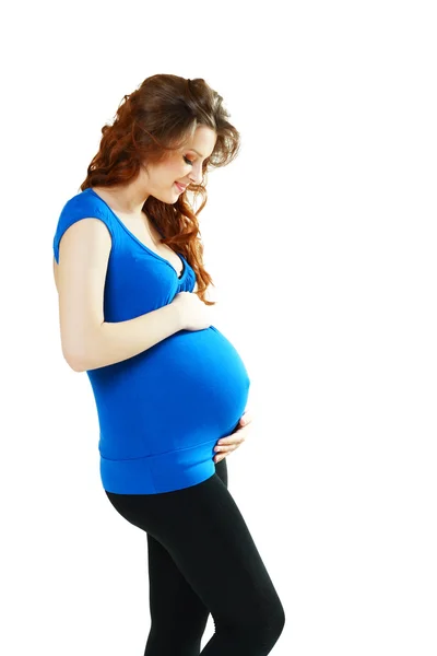 Молодая беременная женщина — стоковое фото