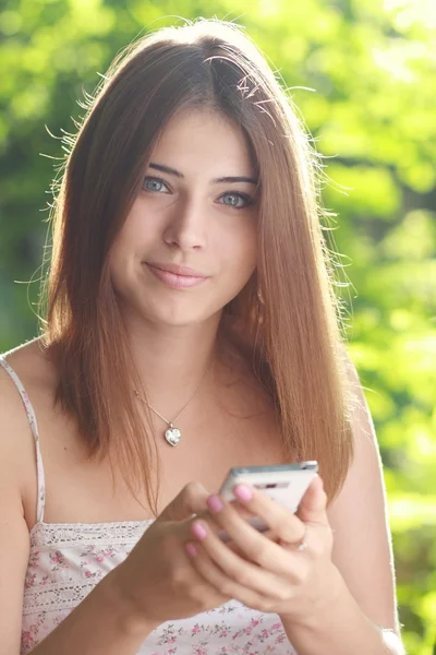 Woman holds smartphone — Stock Photo, Image