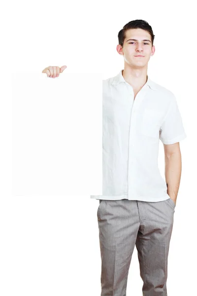 Young man holding blank white card — Stock Photo, Image