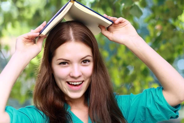 Teenage girl with book Royalty Free Stock Images