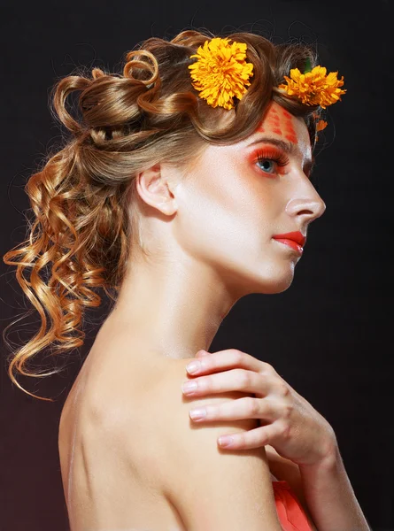 Woman with orange artistic visage — Stock Photo, Image