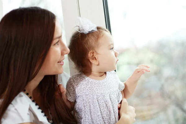 Girl on mother's hands — Stock Photo, Image