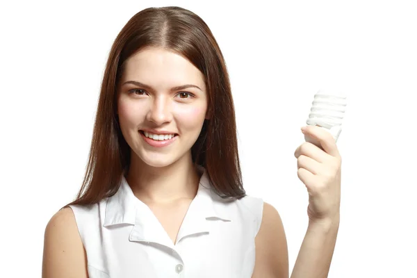 Woman holding energy saving lamp bulb — Stock Fotó