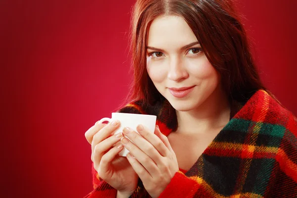 Woman drinking hot drink — Stock Photo, Image