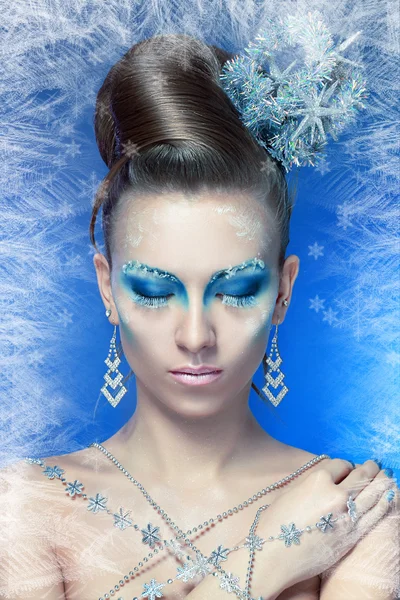 Woman with silver blue artistic make-up Stock Picture