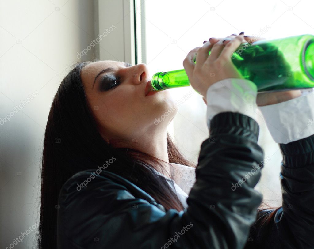 Woman in depression drinking alcohol