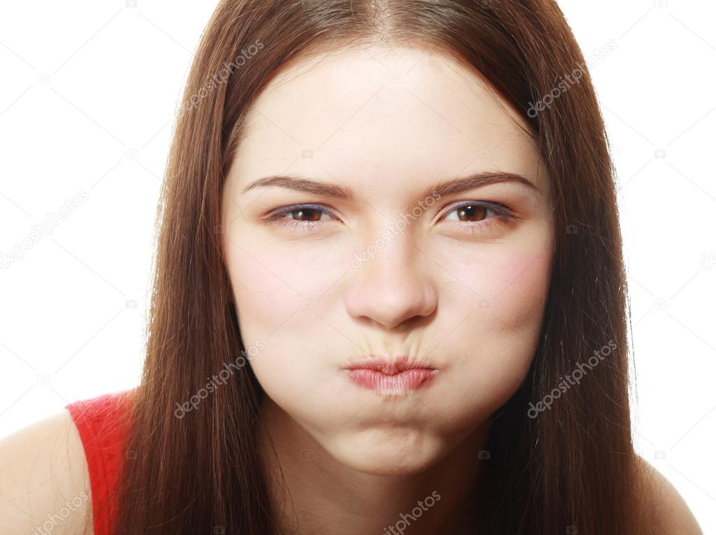 Woman blowing cheeks