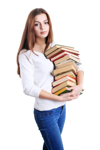 Menina abraçando um livro pilha — Fotografia de Stock