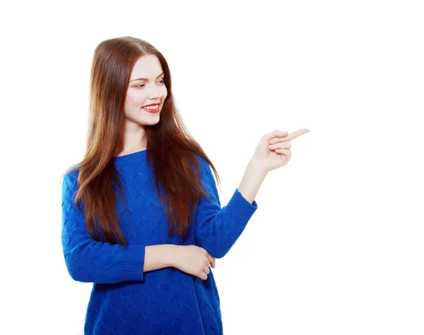 Woman in blue sweater pointing — Stock Photo, Image