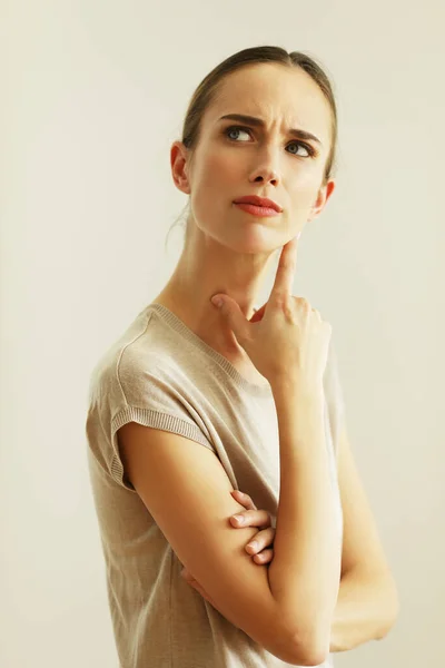 Portrait Suspicious Woman Wondering Holding Hands Next Her Face Posing —  Fotos de Stock