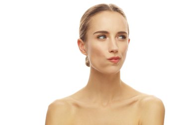 beautiful pensive woman purse her lips, isolated over white background