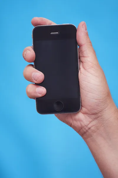 Hand holding a smartphone — Stock Photo, Image